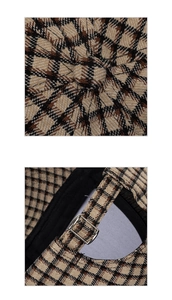 Detail view of plaid baseball cap showing top button stitching and metal strap adjustment buckle
