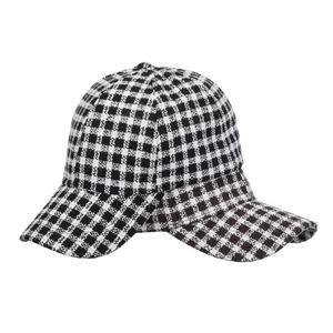 Classic black and white houndstooth plaid baseball cap with a vintage curved brim style