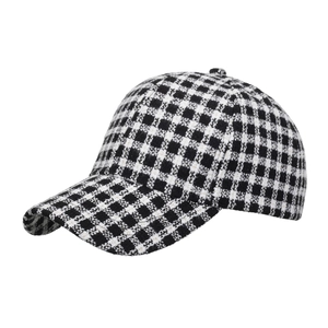 Classic black and white checkered baseball cap with curved brim and textured weave fabric