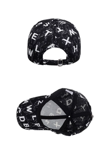 Detail view of black baseball cap with white letter print and metal back buckle