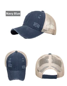 Detailed view of navy blue distressed cotton cap with beige breathable mesh back and buckle