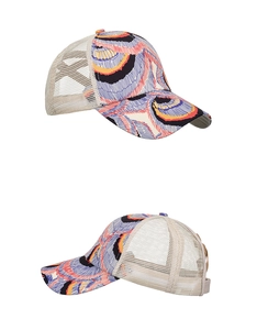 Close-up of multicolor abstract print pattern and breathable mesh back on the baseball cap