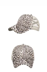 Detail view of leopard print baseball cap featuring breathable beige mesh panels