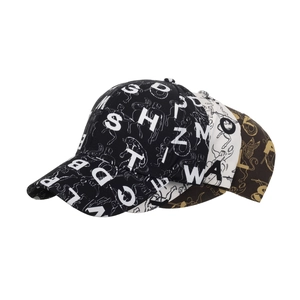 Three printed baseball caps in black, white, and brown with letter patterns for outdoors