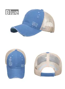 Detailed view of blue washed denim baseball cap with distressed holes and mesh back