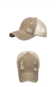 Detailed side and front view of a khaki distressed trucker hat with breathable mesh