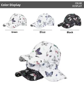 Detailed view of butterfly print baseball caps in green blue and black with frayed edges