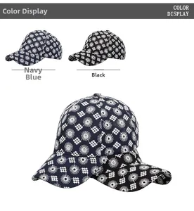 Detail of navy blue and black baseball caps with daisy pattern and sturdy brim