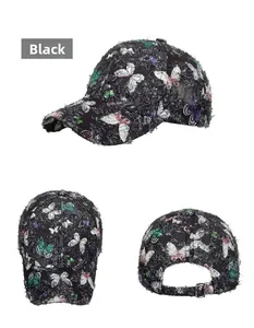 Detail view of black butterfly print baseball cap with frayed edges and metal buckle