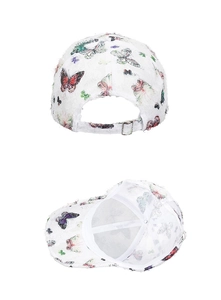 Detailed view of butterfly print baseball cap with metal buckle and internal support strap