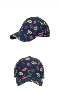 Detail of navy baseball cap with neon lip print and classic curved brim style