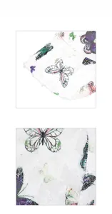 Detail display of butterfly print and distressed torn edges on the white sun hat fabric