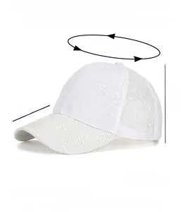 Detailed view of white floral lace embroidery on 100% polyester baseball cap