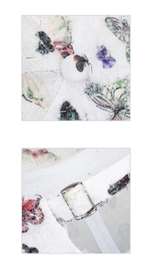 Detail of white butterfly print baseball cap showing fabric texture and metal buckle