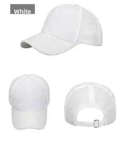 Detail view of white lace embroidered baseball cap with breathable mesh and adjustable buckle