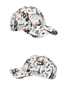 Detailed views of white cotton baseball cap with Eiffel Tower and Paris theme prints