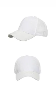 Detail of white baseball cap showing floral lace embroidery and mesh texture
