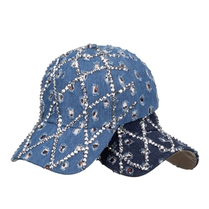 Distressed denim baseball cap with leopard print patches and sparkling rhinestone patterns