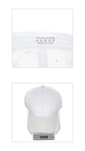 Detail of white lace baseball cap with floral embroidery showing weight of 63.1g