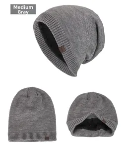 Detail view of medium heather gray beanie with thick fleece lining and leather logo tag
