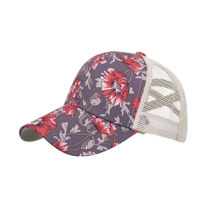 Floral print trucker hat with red poppy patterns and breathable beige mesh back