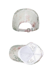 Detail of floral embroidery on a baseball cap with adjustable silver metal buckle