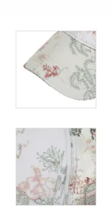 Close-up of floral embroidery on a white mesh baseball cap with pink flower detail