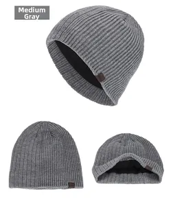 Detail view of heather grey knit beanie showing the warm black fleece lining and texture