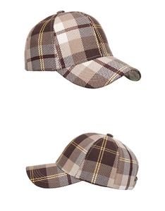 Detailed macro view showing the brown plaid pattern and fabric texture of the baseball cap