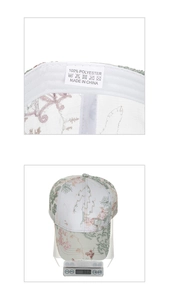 Detail of floral lace baseball cap showing wash label and total weight on scale