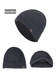 Detailed view of navy blue winter knit hat with thick fleece lining and ribbed texture
