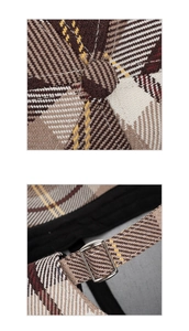 Detailed macro view of retro plaid pattern fabric and silver metal adjustable buckle