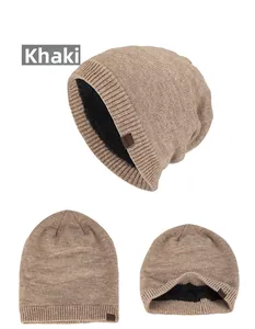 Detail view of the khaki knitted beanie with thick black fleece lining and leather patch
