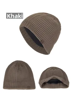 Detail of khaki ribbed beanie with warm black fleece lining and leather patch