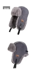 Close-up of grey winter aviator hat with soft plush lining and leather side badge detail