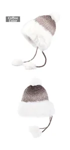 Detail of winter knitted trapper hat in coffee brown with plush faux fur trim and pom-pom