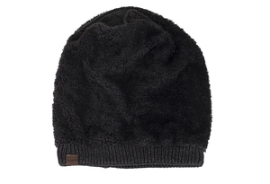 Detail view of winter knitted hat with plush black texture and ribbed grey hem trim