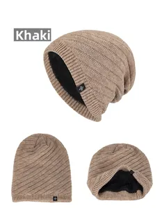 Detail view of khaki knit beanie featuring thick fleece lining and snowflake label