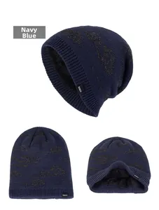Detailed view of navy blue knitted beanie with thick black fleece lining and cloud pattern