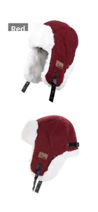 Detailed close-up of wine red trapper hat with soft white plush lining and ear flaps
