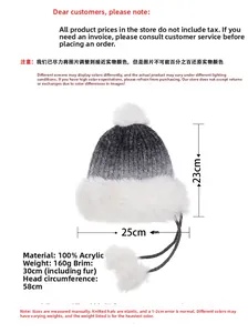 Detail view of winter trapper hat showing gradient grey knit and thick white faux fur trim