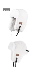 Detailed view of white fleece trapper hat with soft faux fur trim and leather patch