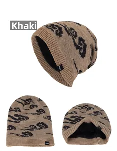 Detail of khaki knitted winter hat featuring thick black fleece lining and cloud pattern
