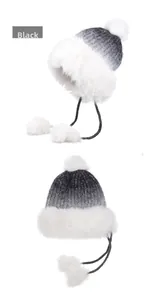 Detailed view of women's winter earmuff hat with white fluffy faux fur and gradient knit