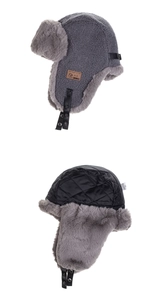 Detail view of the plush fleece lining and leather strap on a winter pilot trapper hat