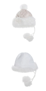 Detail of white winter trapper hats with quilted pattern and fluffy faux fur lining