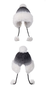 Detailed close-up showing thick knit texture and white faux fur trim on winter hat
