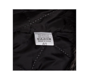 Detail view of the quilted black inner lining and white care label with fabric composition