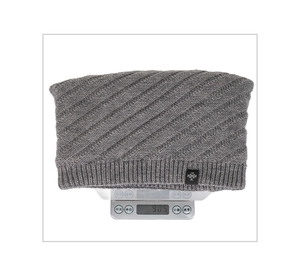 Detailed view of grey twill knit beanie on electronic scale weighing 90.5 grams
