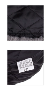 Detail of grey faux fur lining and black quilted diamond pattern on winter aviator hat